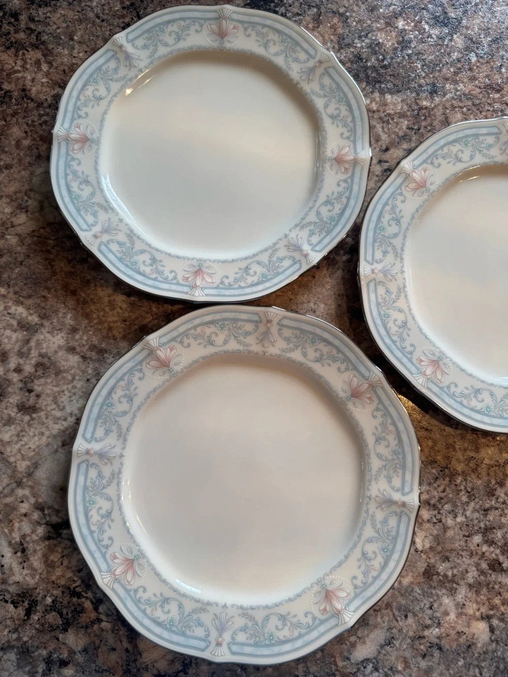 Noritake Crown Flower Dinnerware with Pale Blue and Soft Pink Floral Border